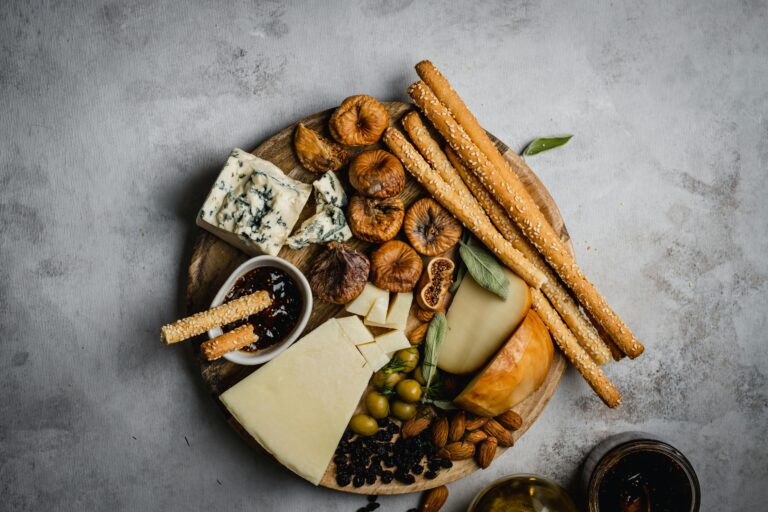 a plate of cheese and nuts