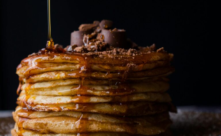 a stack of pancakes with syrup on top